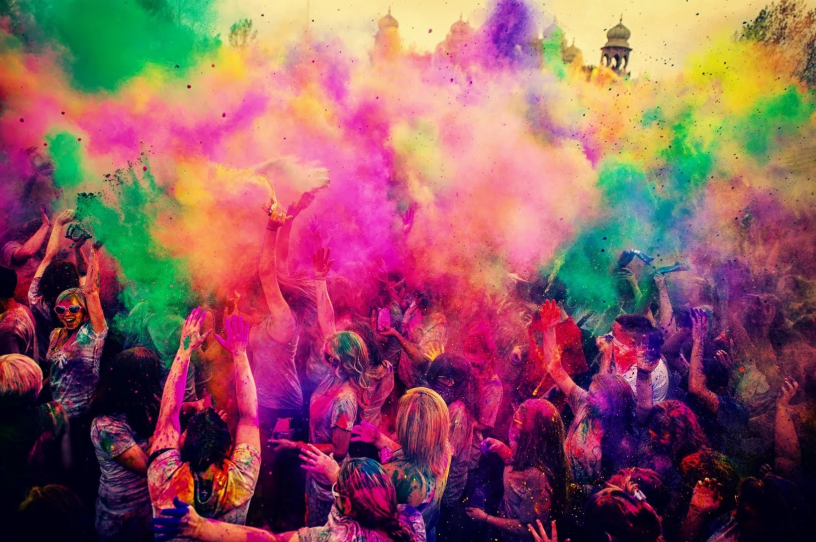 Bright colours being sprayed at Holi Festival