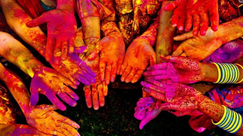 Hands covered in colour makes everyone look the same