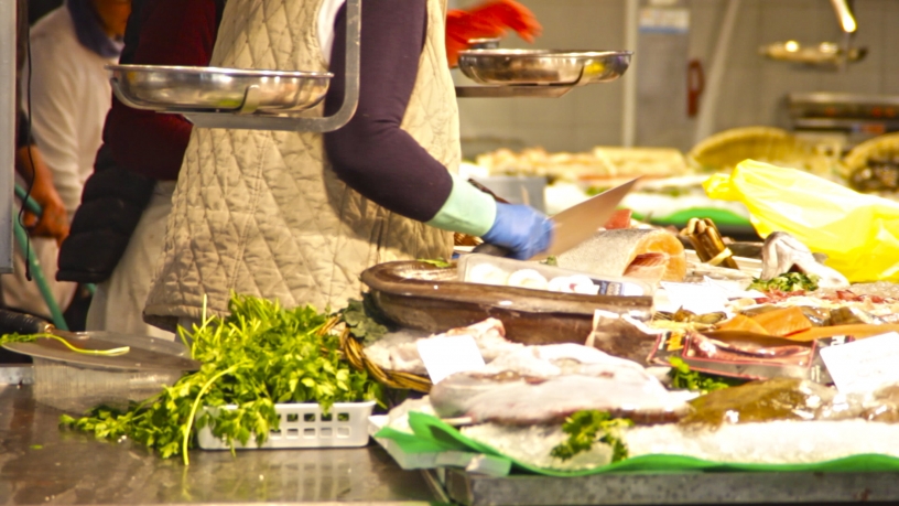 Fishmonger at a market in Barcelona