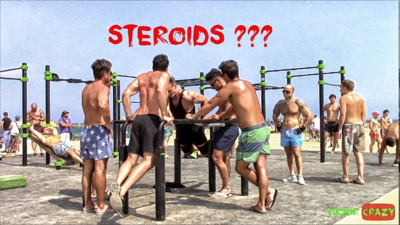 Men using the gym at the beach