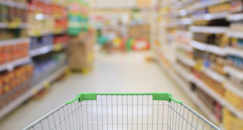 Supermarket and trolley in focus