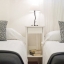 Sypialnia w Barcelonie z dwoma łóżkami