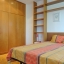 Double bedroom with desk and wardrobe