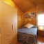 Cosy bedroom with wooden panels